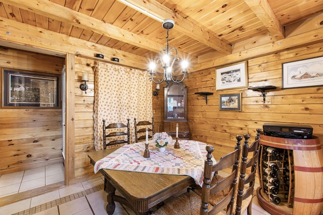 tiled dining area with wood ceiling, wooden walls, and beamed ceiling