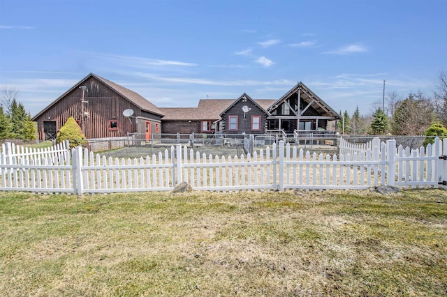 view of front facade with fence private yard and a front yard