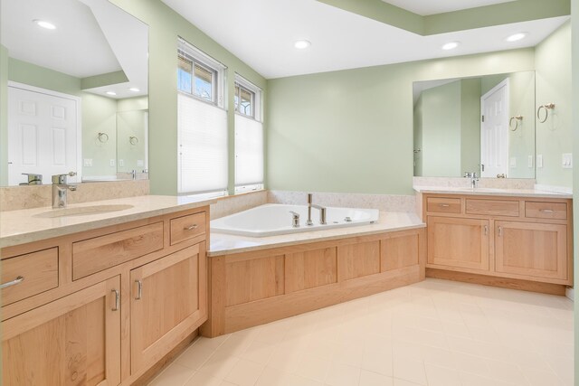 full bathroom featuring a sink, tile patterned floors, recessed lighting, and a bath