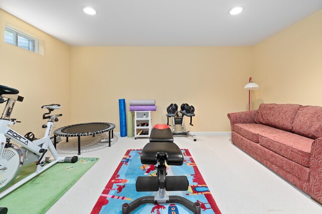workout area featuring recessed lighting, carpet, and baseboards