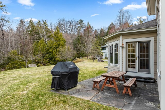 view of yard featuring french doors and a patio