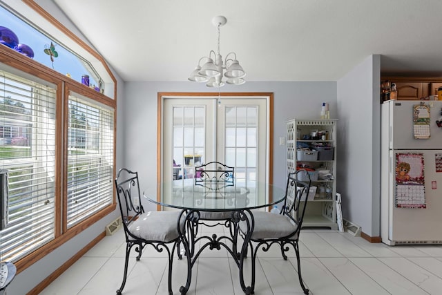 dining area featuring an inviting chandelier, baseboards, visible vents, and a wealth of natural light