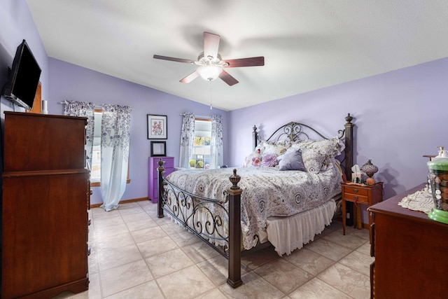 bedroom with a ceiling fan and vaulted ceiling