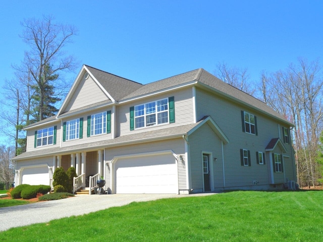 view of front of property featuring a garage, central air condition unit, driveway, and a front yard