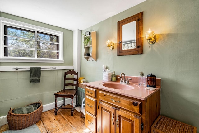 bathroom featuring vanity and wood finished floors