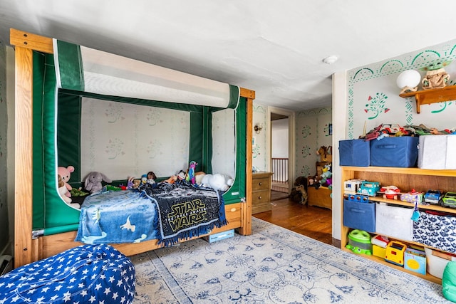 bedroom with wood finished floors