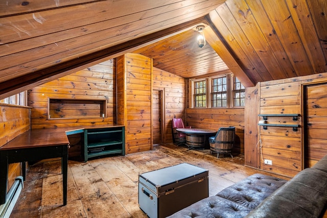 living area featuring wood walls, a baseboard radiator, lofted ceiling, and hardwood / wood-style floors