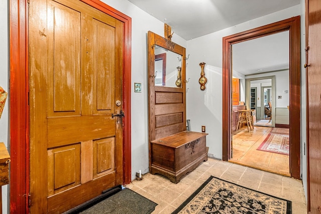 foyer entrance featuring light tile patterned floors