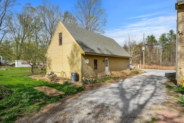 view of property exterior featuring roof with shingles