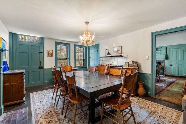 dining space featuring an inviting chandelier