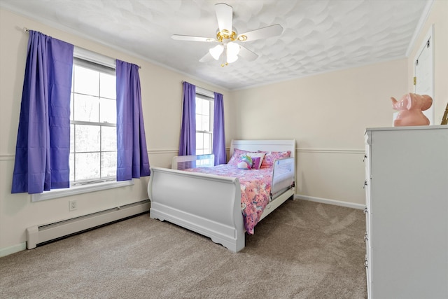 bedroom featuring multiple windows, a ceiling fan, a baseboard heating unit, and carpet flooring