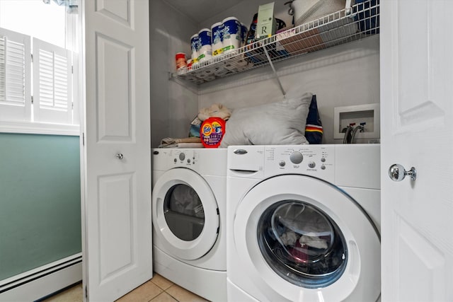 laundry room with separate washer and dryer, laundry area, a baseboard heating unit, and light tile patterned floors