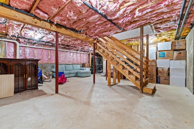 unfinished below grade area featuring stairway