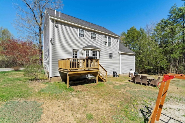 rear view of house featuring a wooden deck, a yard, and stairway
