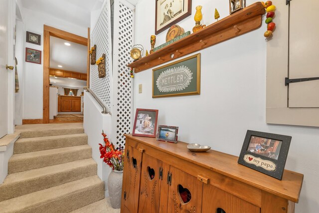 stairs featuring recessed lighting