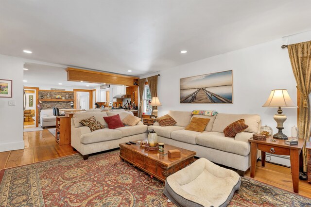 living room featuring recessed lighting and light wood finished floors