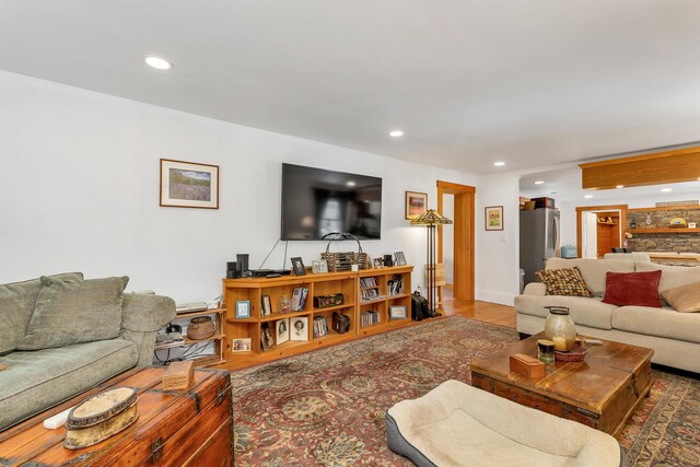 living room with recessed lighting and wood finished floors
