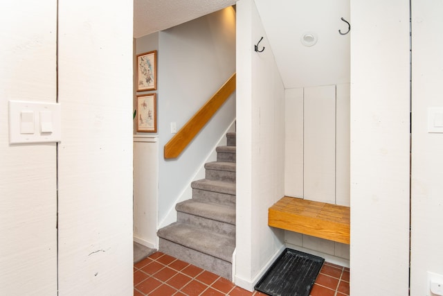 stairs with tile patterned flooring