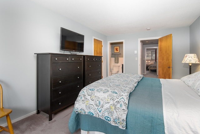 carpeted bedroom featuring baseboards