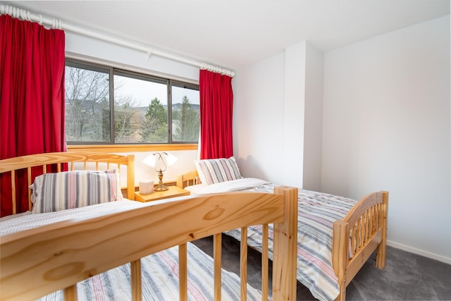 carpeted bedroom with baseboards