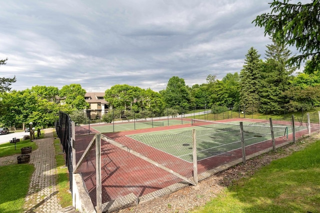 view of tennis court with fence