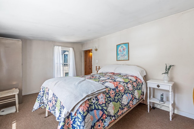 bedroom featuring baseboards and carpet flooring