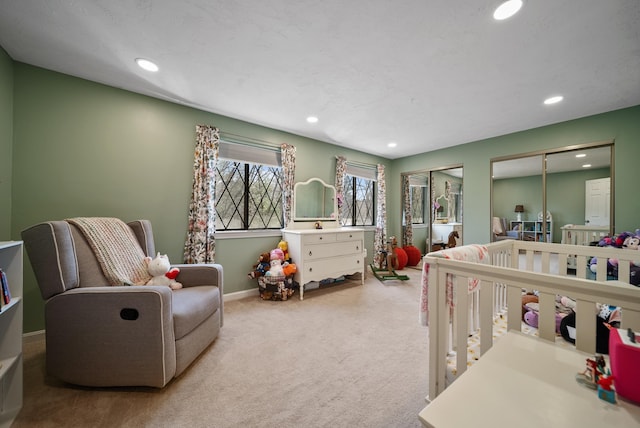 carpeted bedroom with baseboards, two closets, and recessed lighting