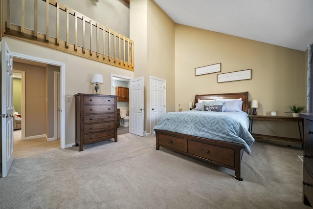 bedroom with baseboards, light carpet, and high vaulted ceiling