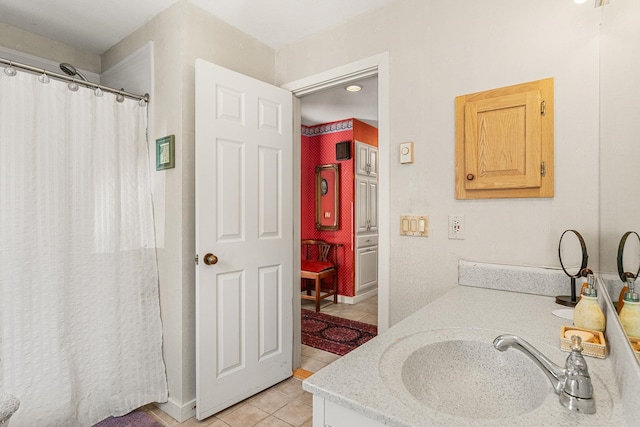 bathroom with a shower with curtain, tile patterned floors, and vanity