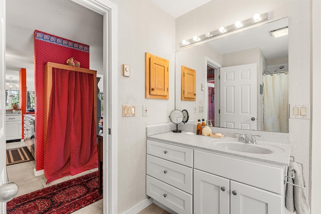 full bathroom featuring vanity, a shower with shower curtain, and tile patterned floors