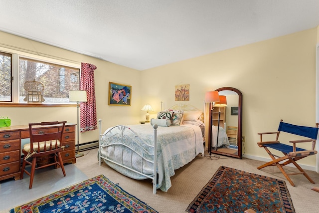 bedroom featuring baseboards, carpet, and baseboard heating