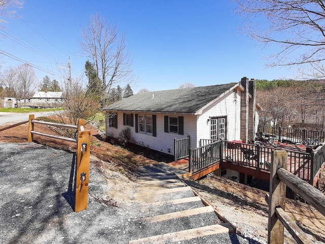 00 Pleasant St, Cavendish, VT 05142 - view of front of property featuring a wooden deck, roof with shingles, and a chimney