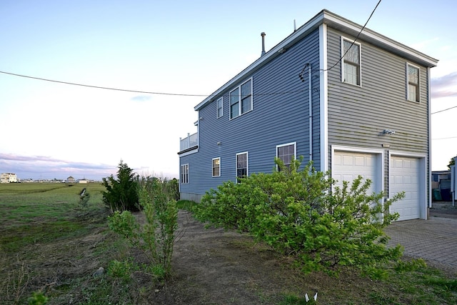 35 Glade Path, Hampton, NH 03842 - view of property exterior featuring an attached garage and driveway
