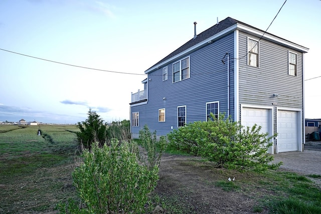 35 Glade Path, Hampton, NH 03842 - view of side of home featuring an attached garage and driveway