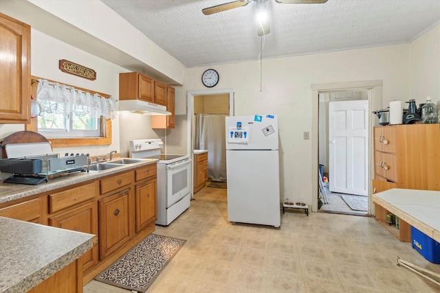 kitchen featuring ceiling fan, a sink, white appliances, brown cabinetry, and under cabinet range hood