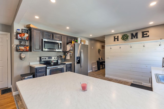 kitchen with light countertops, stainless steel appliances, visible vents, and recessed lighting