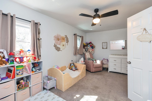 playroom featuring carpet and a ceiling fan