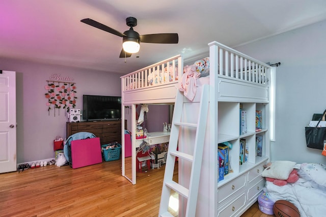 bedroom with ceiling fan and wood finished floors