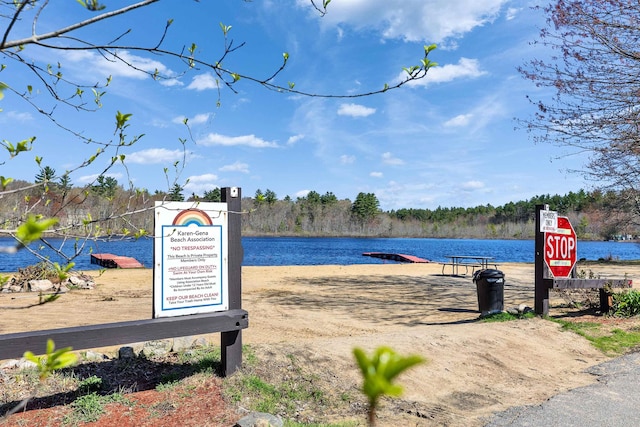 property view of water featuring a boat dock