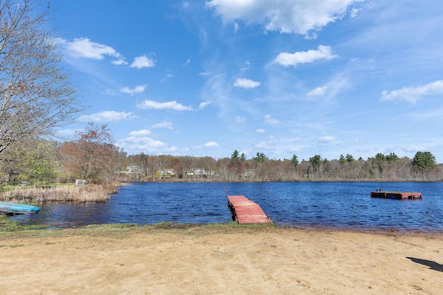 exterior space with a water view and a forest view