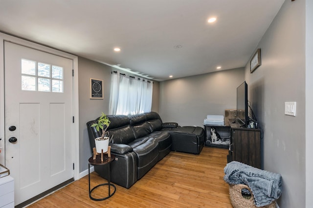 living room with recessed lighting and light wood finished floors