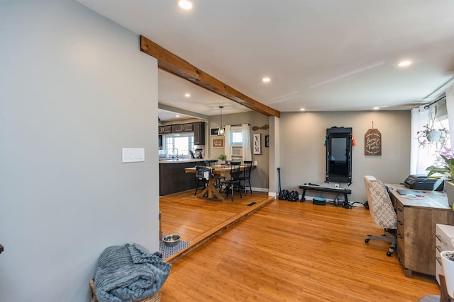 office with recessed lighting, baseboards, a sink, and light wood finished floors