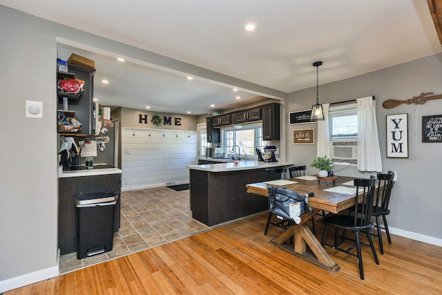 dining space with recessed lighting, baseboards, cooling unit, and light wood-type flooring