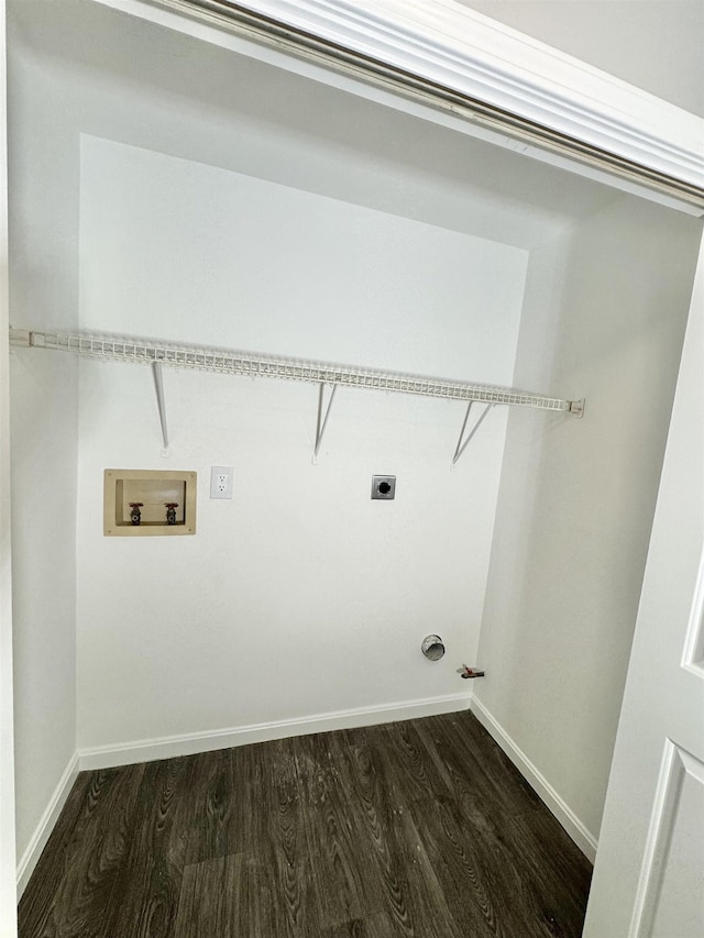 laundry area with laundry area, hookup for a washing machine, baseboards, and dark wood-type flooring