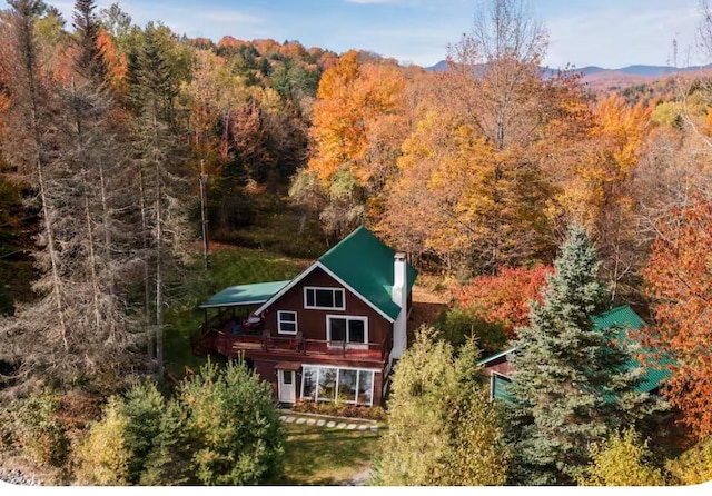 bird's eye view featuring a wooded view