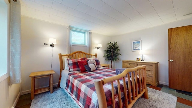 bedroom featuring baseboards