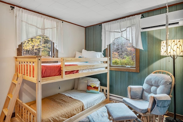 bedroom with an inviting chandelier, multiple windows, a wall unit AC, and wooden walls