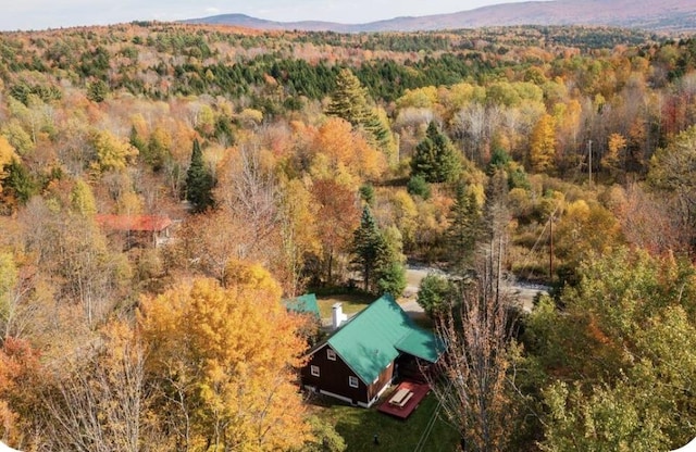 aerial view with a mountain view and a wooded view