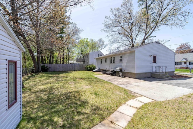 view of yard featuring a patio area and fence