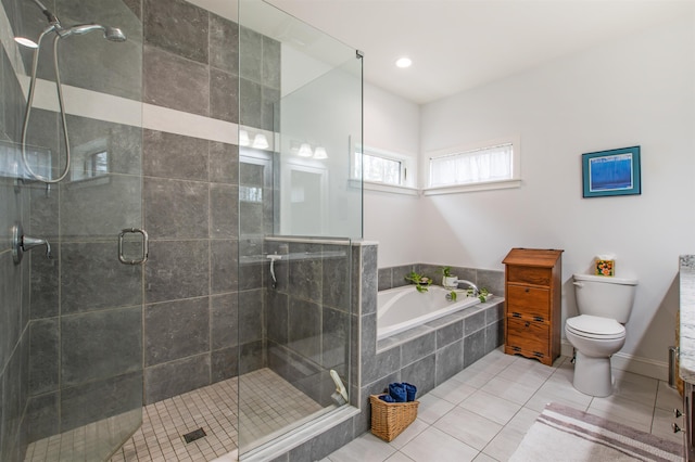 full bath featuring tile patterned flooring, a shower stall, toilet, and a bath